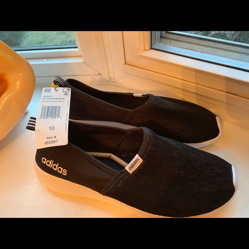 Black slip on Adidas sneakers